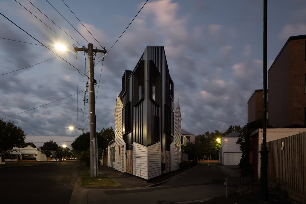 Modern and traditional architecture blend beautifully at dusk in an urban setting.