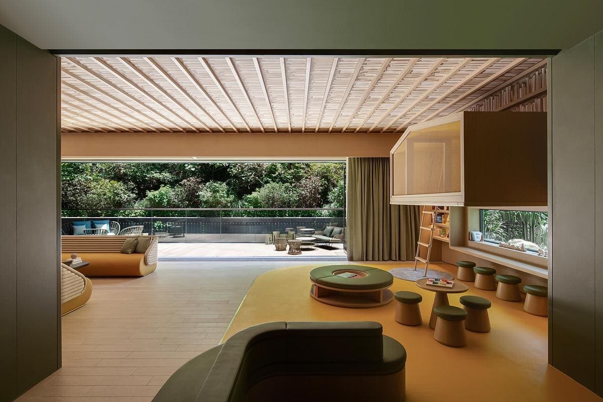 Inviting modern living space with natural light, earthy tones, and seamless indoor-outdoor connection.