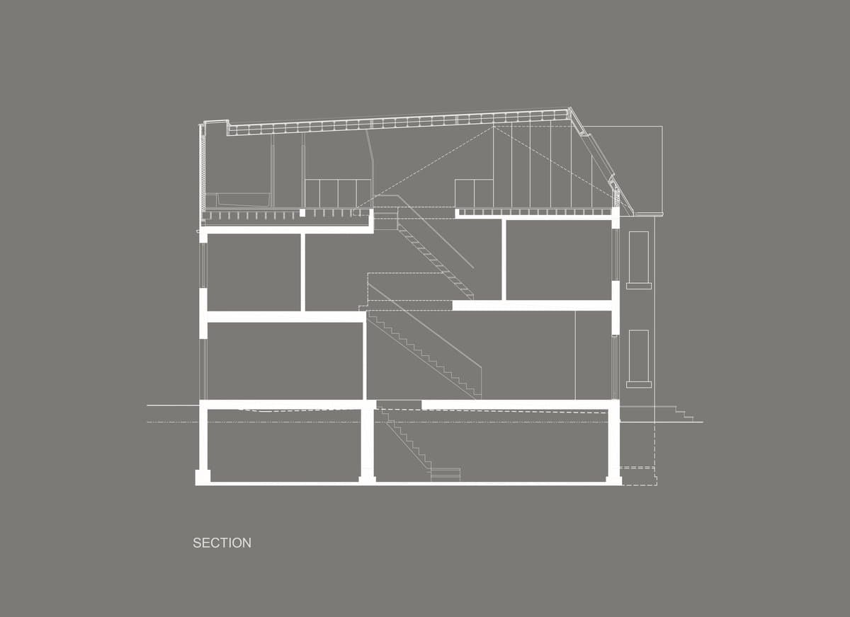 Architectural sectional drawing of a multi-story building with detailed interior layout and structural elements.