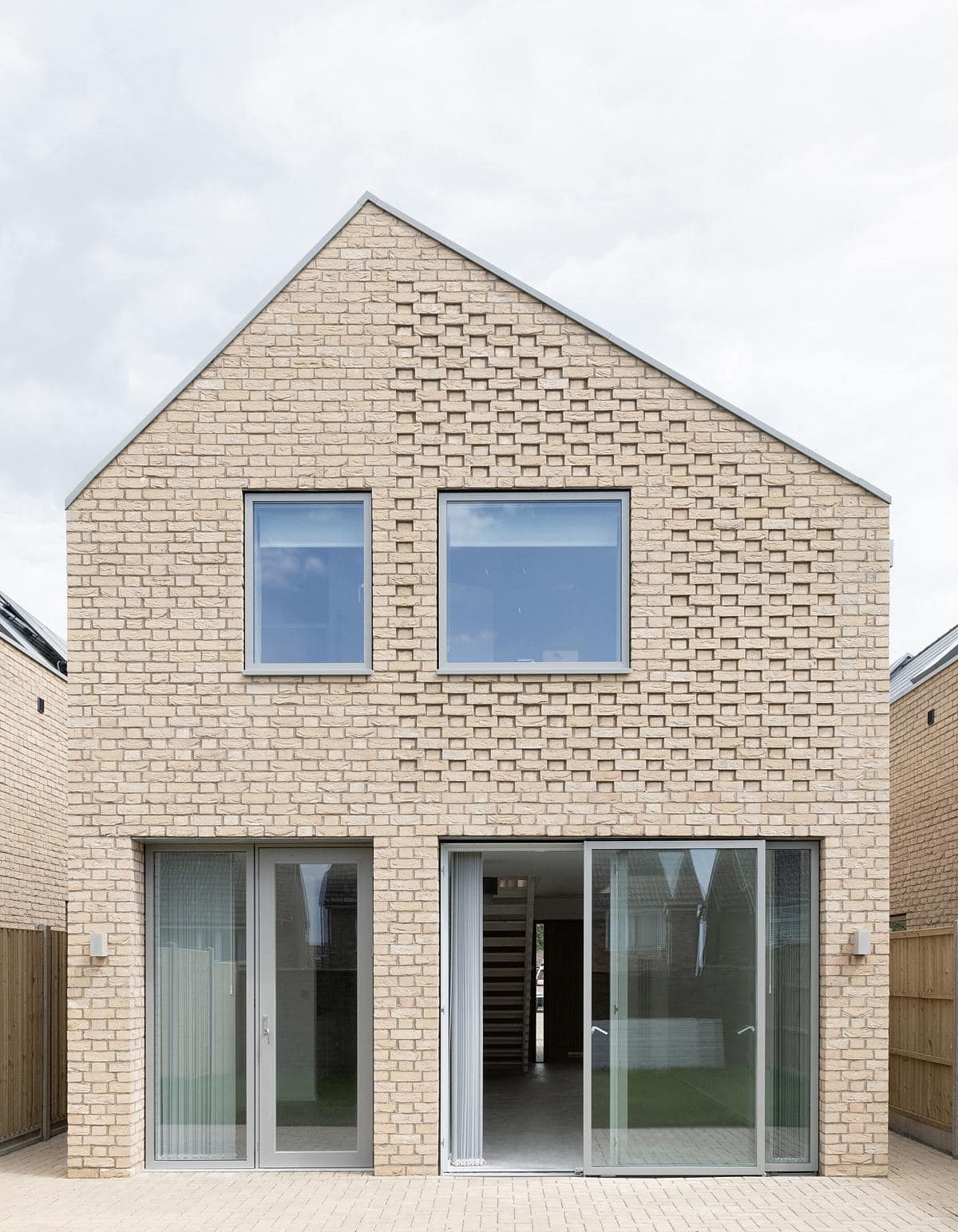 Contemporary two-storey house with minimalist design and seamless indoor-outdoor living.