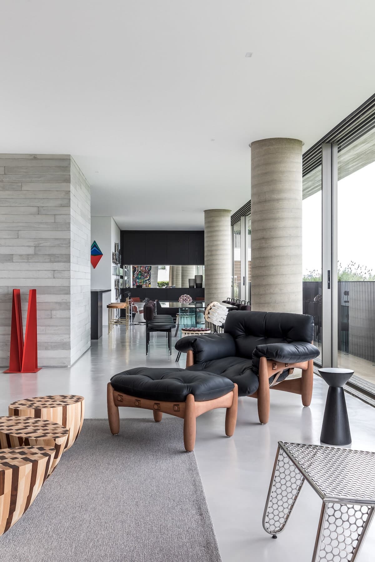 Sophisticated minimalist living space with natural light, neutral tones, and inviting textures.