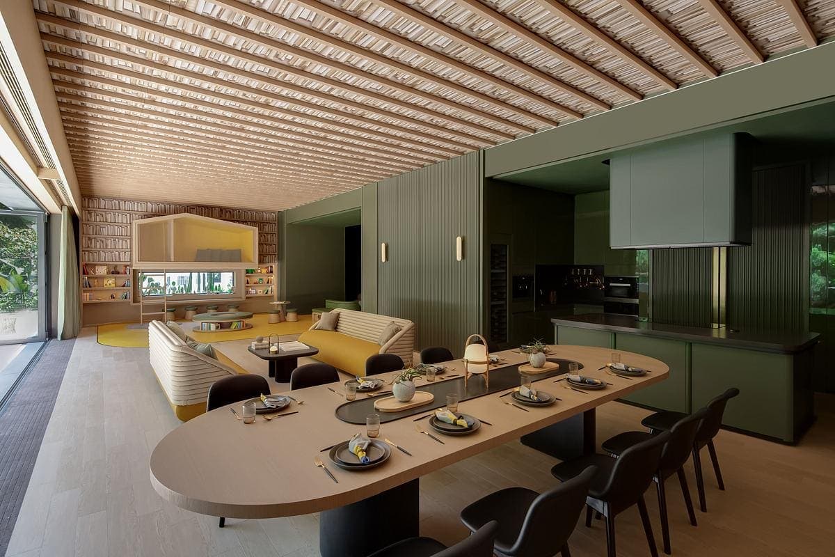 Modern open-plan living area with stylish dining, seamless kitchen design, and natural light.