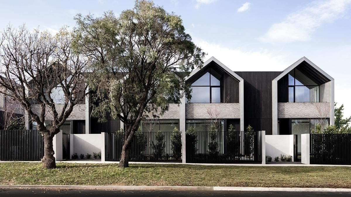 Contemporary residence featuring modern design, striking materials, and harmonious landscaping in a tranquil setting.