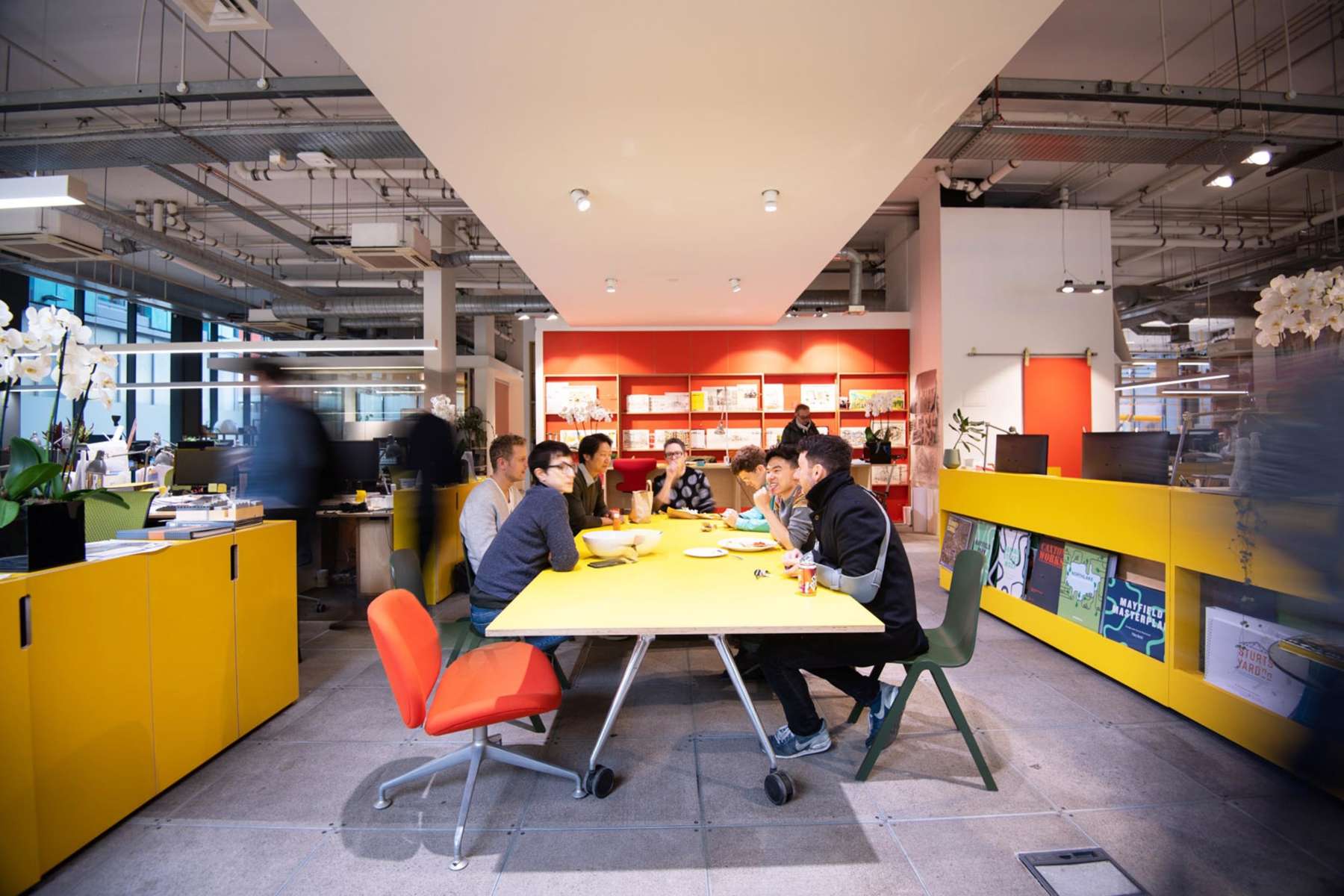 Studio gathering around the yellow table