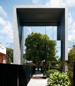 Hawthorn House by ADDARC, mirrored facade reflecting the heritage streetscape, Melbourne