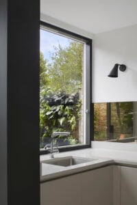 Jax House by Paul Archer Design, glass-infill side extension and exposed brick interior