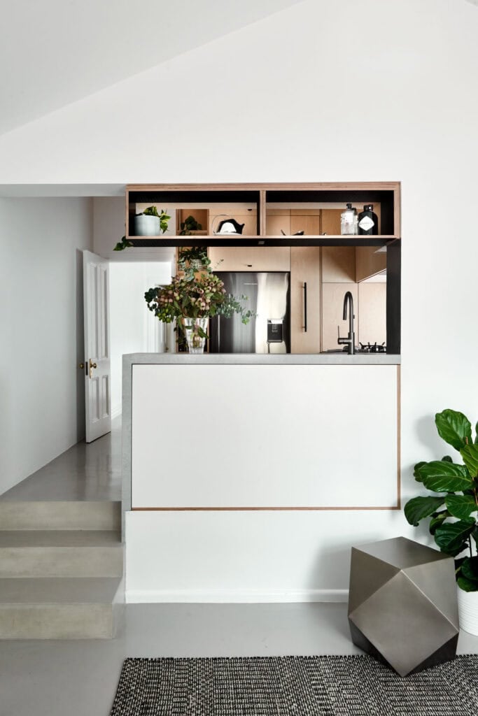 Crafted Workers Cottage, Lygon Street, Melbourne. Plywood joinery and concrete screed kitchen by Minett Studio Architecture & Design