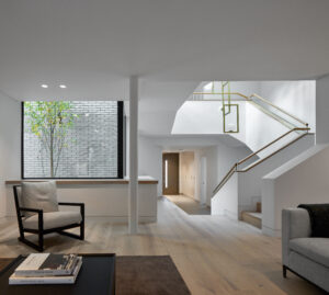 Split House by London Atelier in Sevenoaks Kent, glazed central link connecting two staggered halves of the home