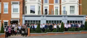 Corporate group photo in front of historic Berkeley Group building.
