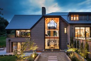 Contemporary family home harmoniously integrates modern design with serene natural surroundings.