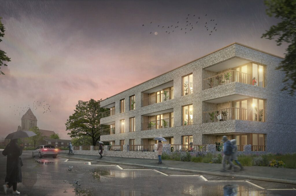 Modern residential building at dusk with warm lights, wet pavement, and pedestrians under drizzle.