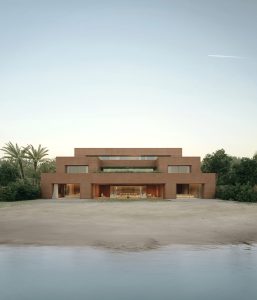 Modern architecture blends seamlessly with nature, featuring warm tones and a serene waterfront.