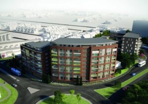 Modern semi-circular residential building with red brick facade, large windows, balconies, and green spaces.