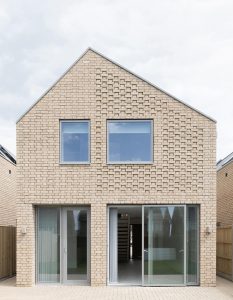 Contemporary two-storey house with minimalist design and seamless indoor-outdoor living.