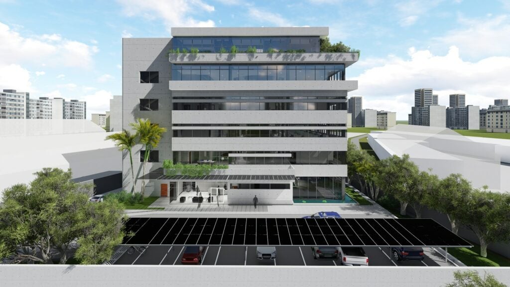 Modern five-story office building with glass facade, balconies, parking, and landscaped greenery.